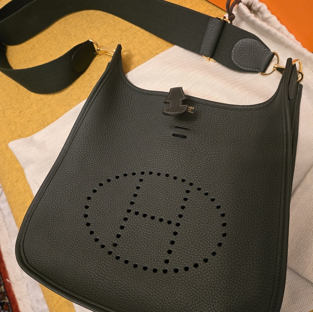 2025 Hermes Evelyn medium size bag in dark green with gold hardware. Bra…